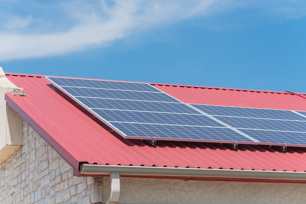 Solar Panel on Metal Roof of House